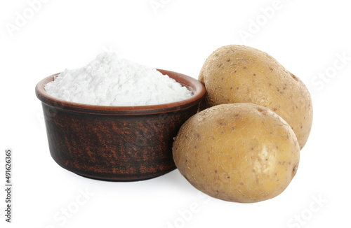 Bowl with starch and fresh potatoes on white background