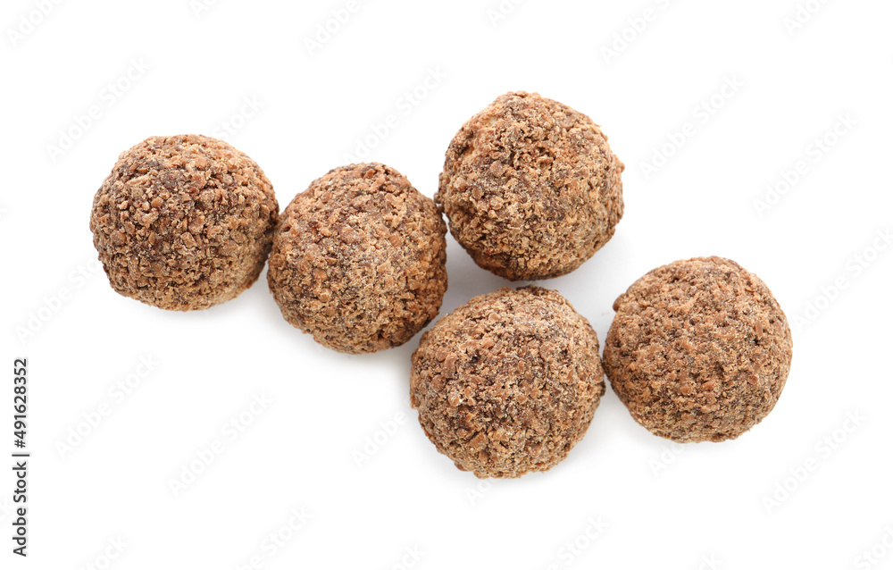 Delicious chocolate truffles on white background, top view Delicious chocolate truffles on white background, top view