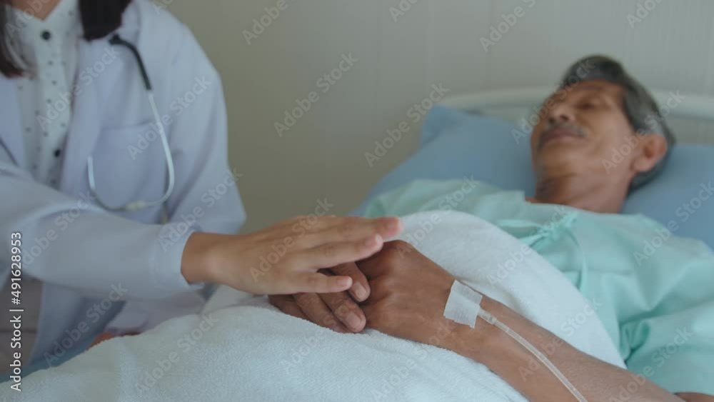 Doctor holding senior patient's hand in hospital, health care and medical concept Doctor holding senior patient's hand in hospital, health care and medical concept