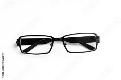glasses for vision correction in black frame on a white background. advertising of the optics store and ophthalmologist services. fashion accessory.
