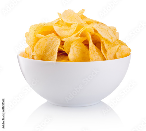 Potato chips in bowl isolated on white background photo