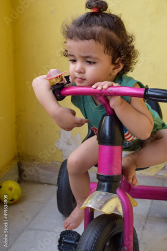 Cute little boy Shivaay driving cycle at home balcony during summer time, Sweet little boy photoshoot during day light, Little boy enjoy cycling at home during photo shoot