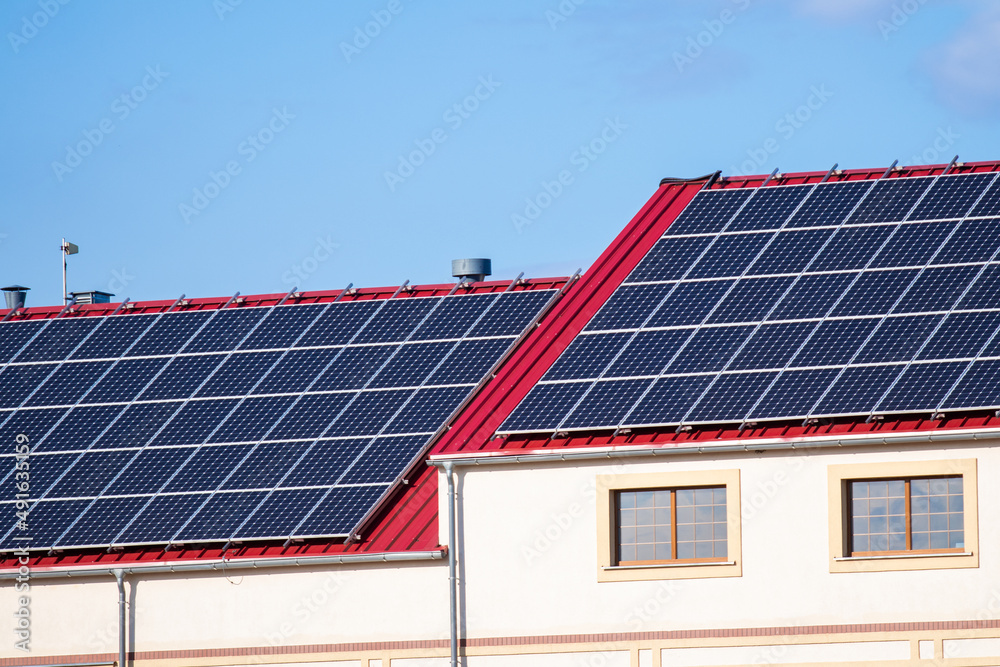 photovoltaic panels on the red roof