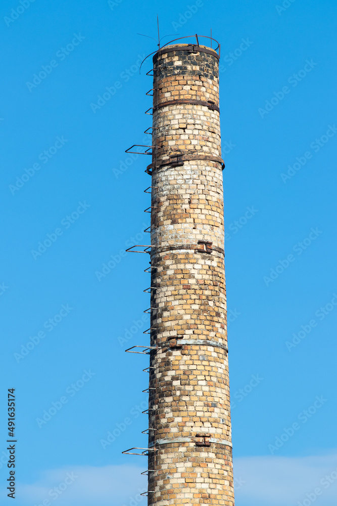 
old brick chimney against the sky
