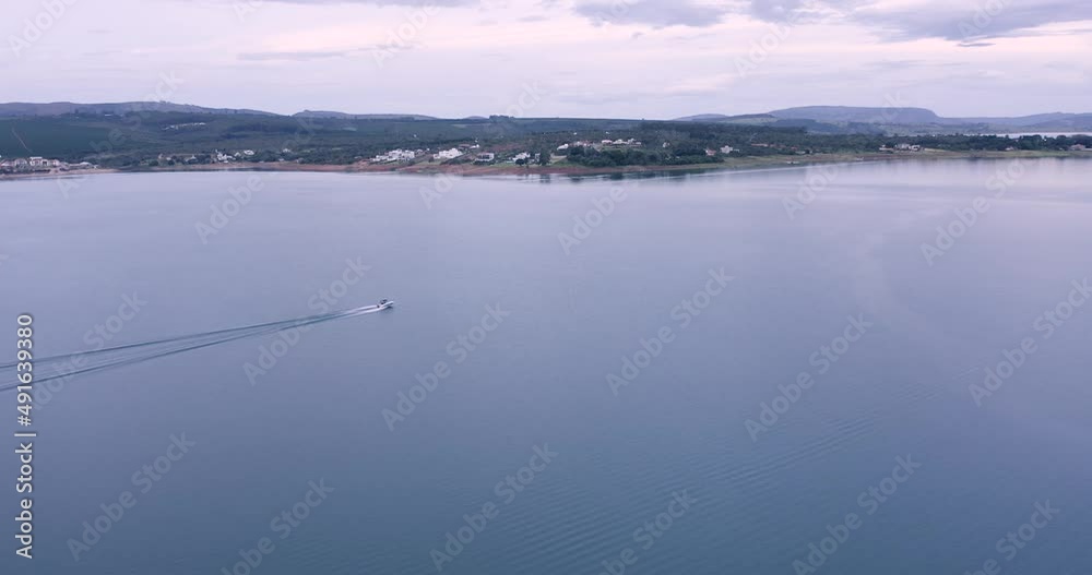Speedboat advances in lake, Brazil, reservoir of Furnas hydroelectric plant Speedboat advances in lake, Brazil, reservoir of Furnas hydroelectric plant