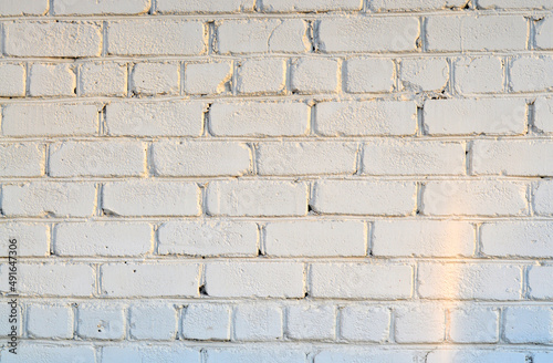 Old white brick wall. Ancient stone texture background. Urban background, white ruined industrial brick wall with copy space. Home and office design backdrop. Vintage effect. 