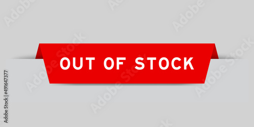 Red color inserted label with word out of stock on gray background