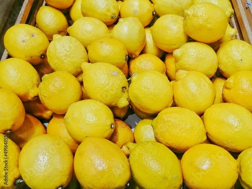 a bunch of yellow lemon at the market.