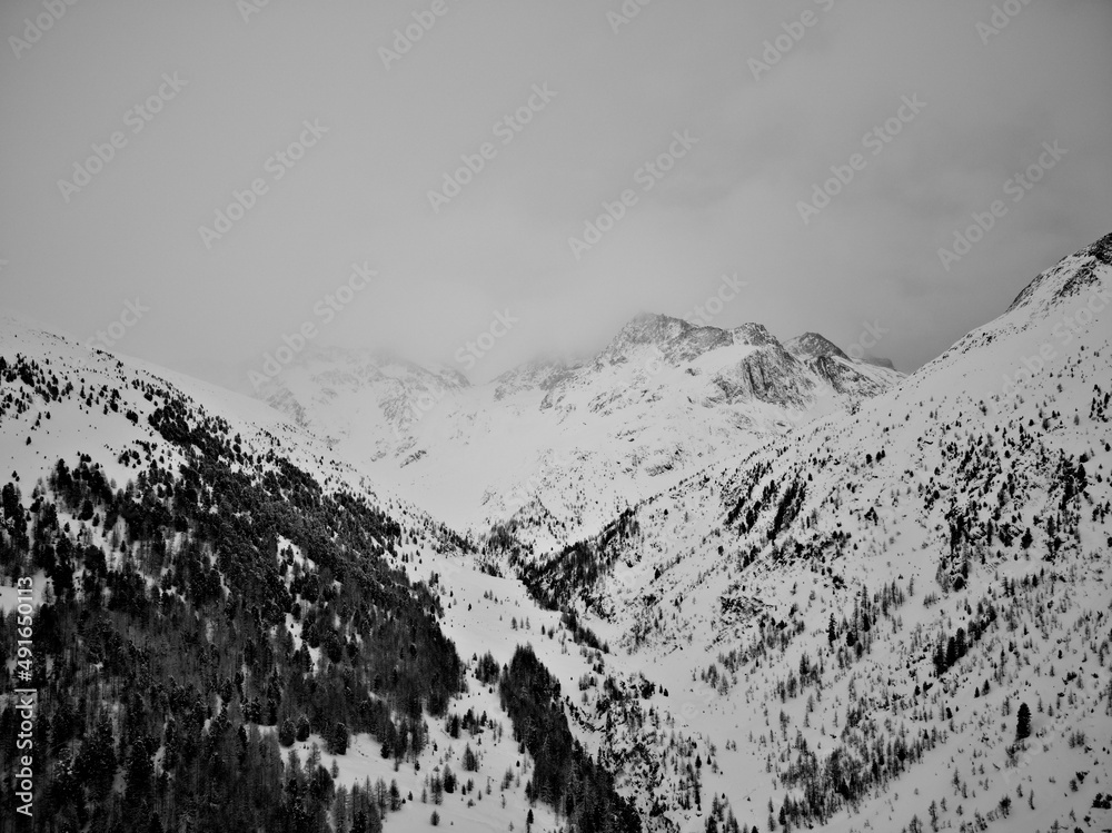 Winter alpine mountain with fog 