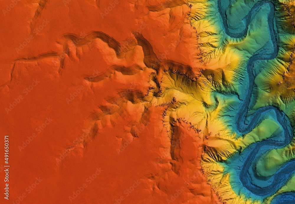 Digital elevation model of a deep stone canyon. A meandering and curving river below. GIS 3D product made after proccesing aerial data.
