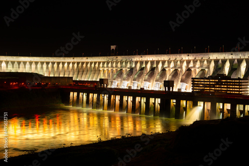 Close-up to the Itaipu Hydroelectric Dam at night. photo