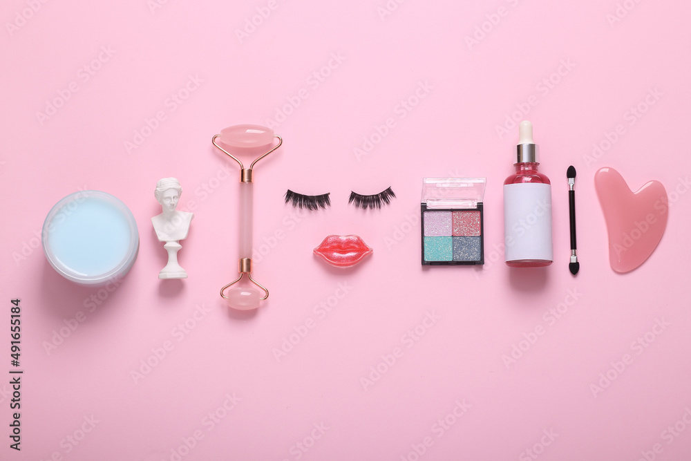 Face of eyelashes and lips with cosmetics and facial skin care products on a pink background. Beauty flat lay Face of eyelashes and lips with cosmetics and facial skin care products on a pink background. Beauty flat lay