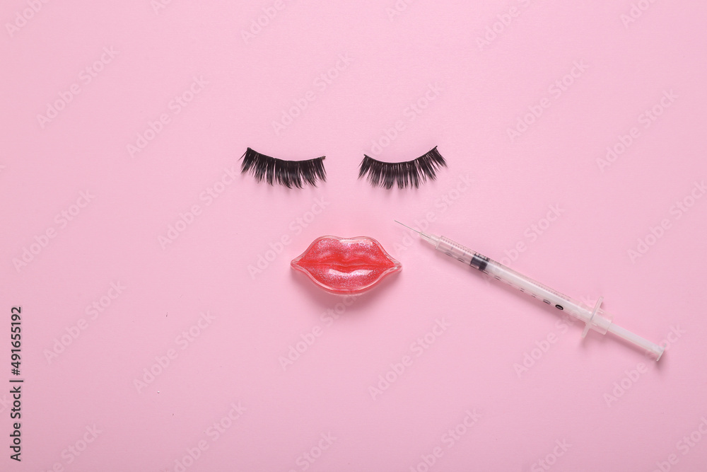 Face of false eyelashes and lips, injection syringe with hyaluronic