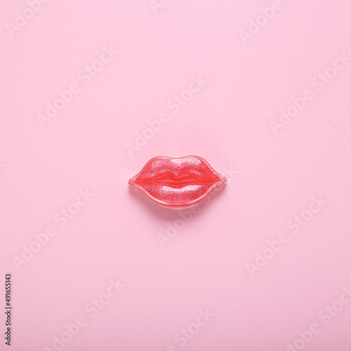 Fototapeta Red lips on a pink background. Beauty minimal concept