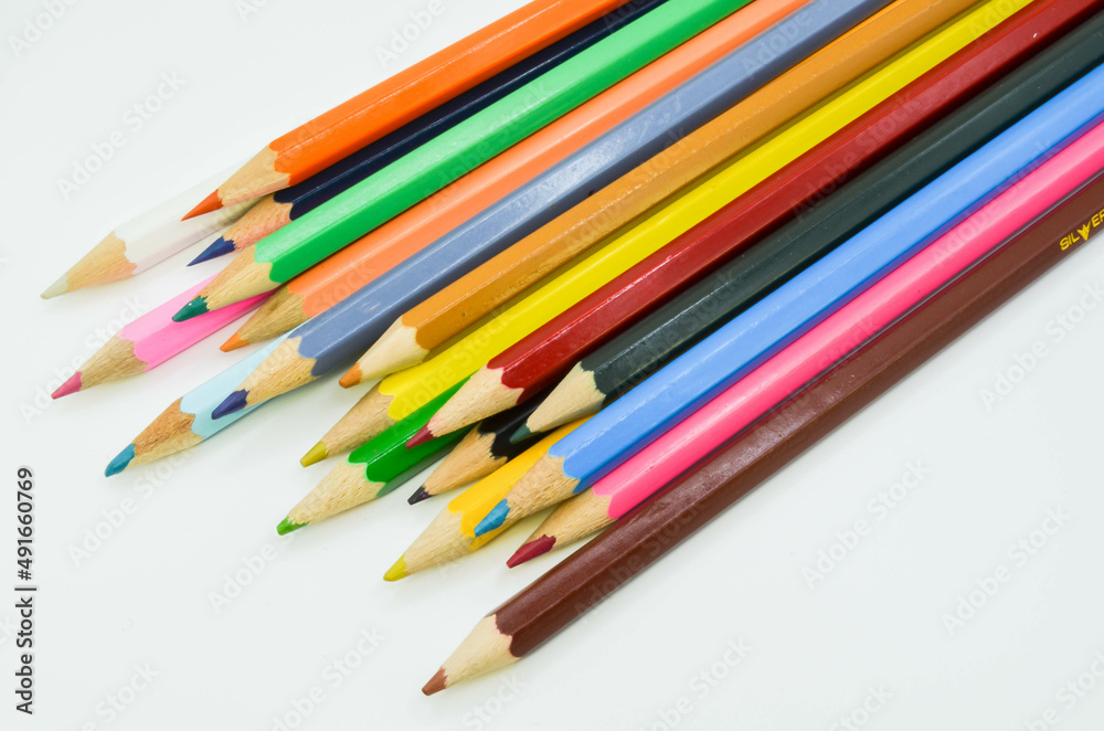 multicolored pencils on a white background multicolored pencils on a white background