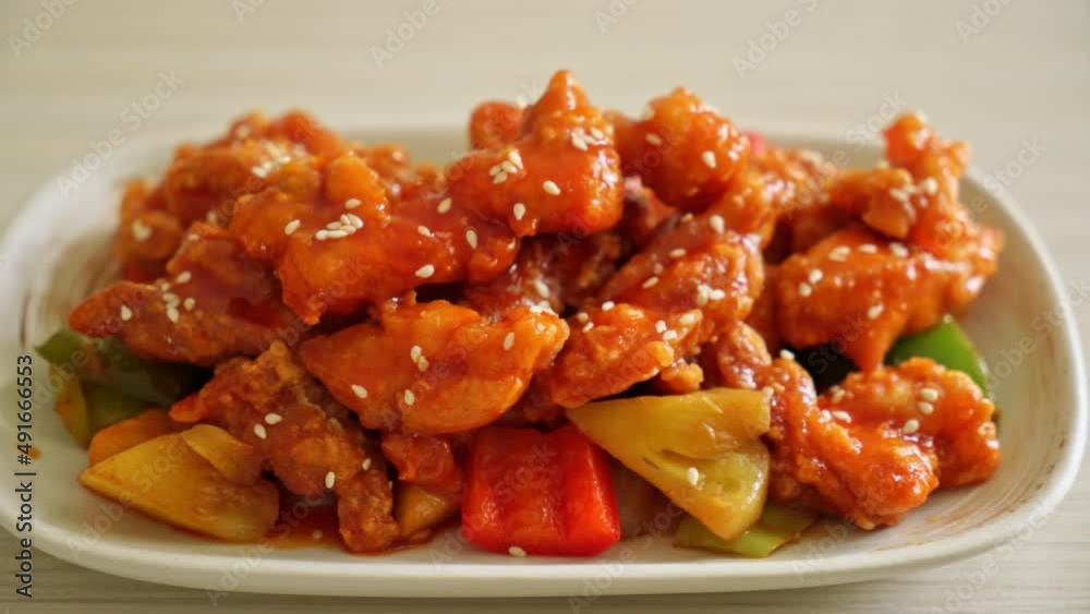 fried crispy chicken with sweet and sour sauce in Korean style fried crispy chicken with sweet and sour sauce in Korean style