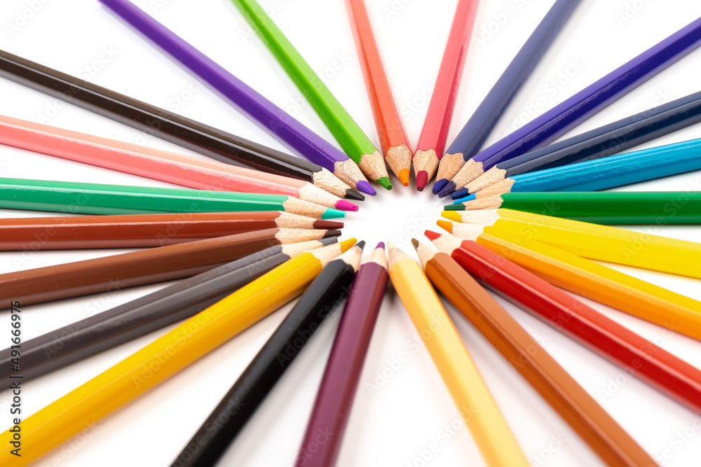 Many multicolored pencils, isolated on white background with copy space. Art and education background. Many multicolored pencils, isolated on white background with copy space. Art and education background.