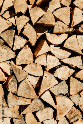 Stacked firewood texture background. Firewood natural