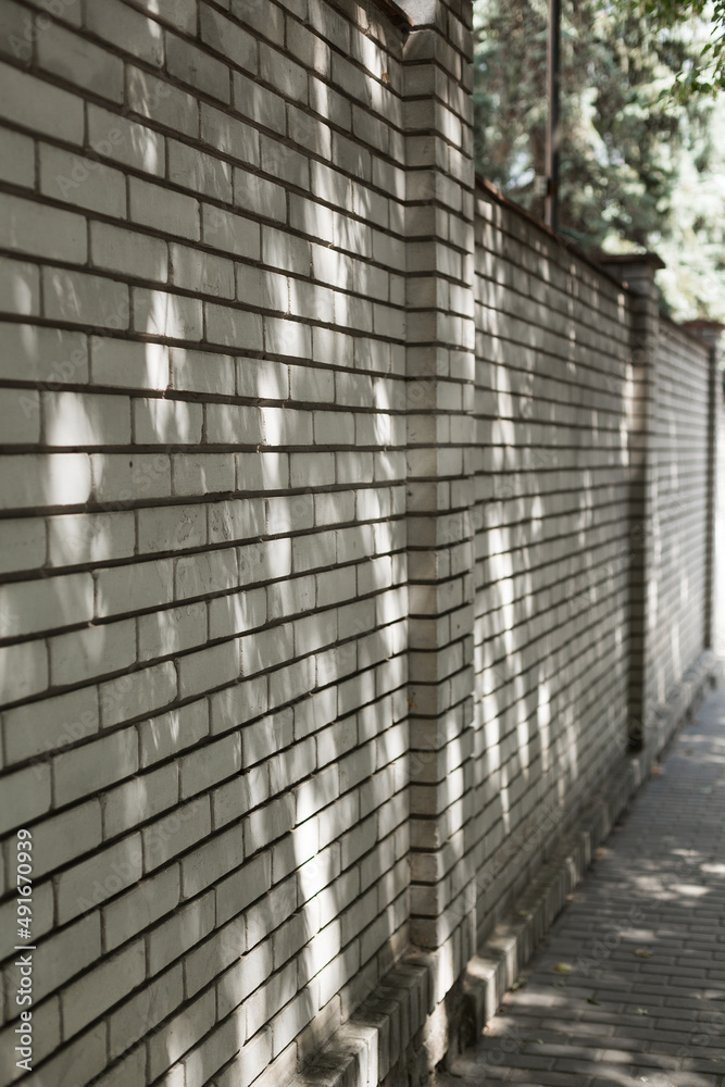 Old white brick wall background in perspective