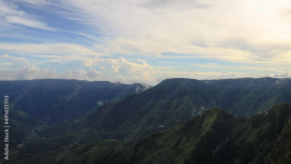 mountain valley with dramatic sky and cloud movement at morning time lapse video is taken at laitlum peak shillong meghalaya india. mountain valley with dramatic sky and cloud movement at morning time lapse video is taken at laitlum peak shillong meghalaya india.