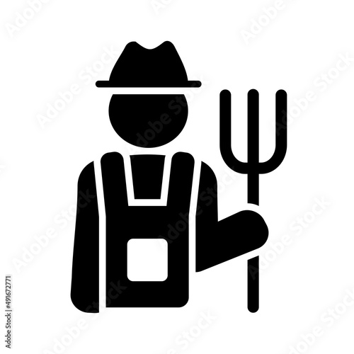 Farmer holding pitchfork vector glyph icon