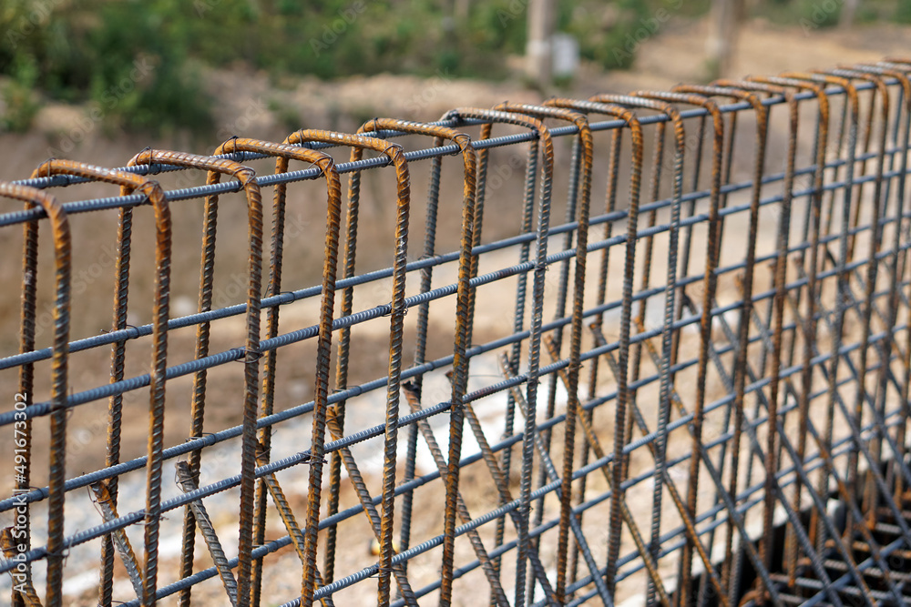 Rebar iron to be used for building foundation of new building at construction site. Wire steel rod to reinforce. Rebar iron to be used for building foundation of new building at construction site. Wire steel rod to reinforce.