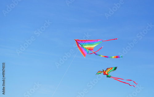 Vibrant kite on blue sky background