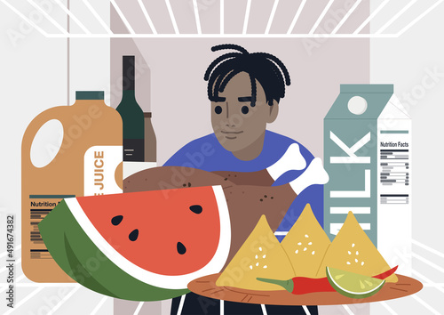 A young male African character looking into a fridge, lunch at home, a lockdown lifestyle