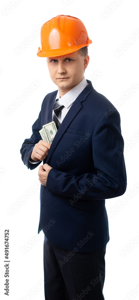 Portrait of a man in a blue business suit with a tie and helmet. builder, foreman, engineer holds dollars. the businessman made a profit, money. isolated. White background. Portrait of a man in a blue business suit with a tie and helmet. builder, foreman, engineer holds dollars. the businessman made a profit, money. isolated. White background.