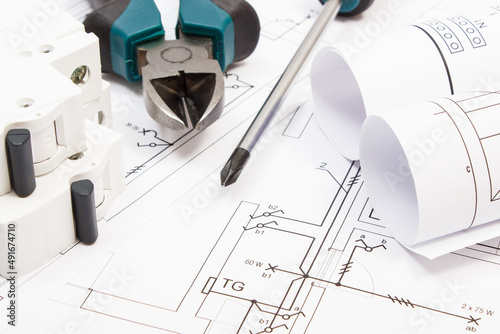 Work tools, electric fuse and diagrams of plan with electrical installation. Building home