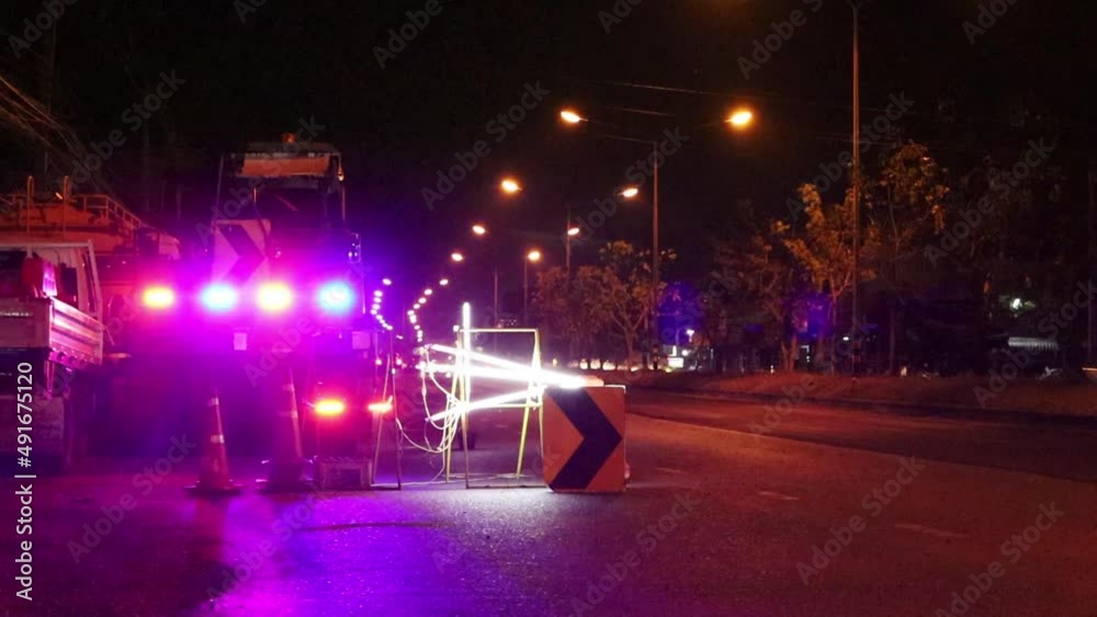 Warning lights flashing on the road. Multicolored flashing lights warn