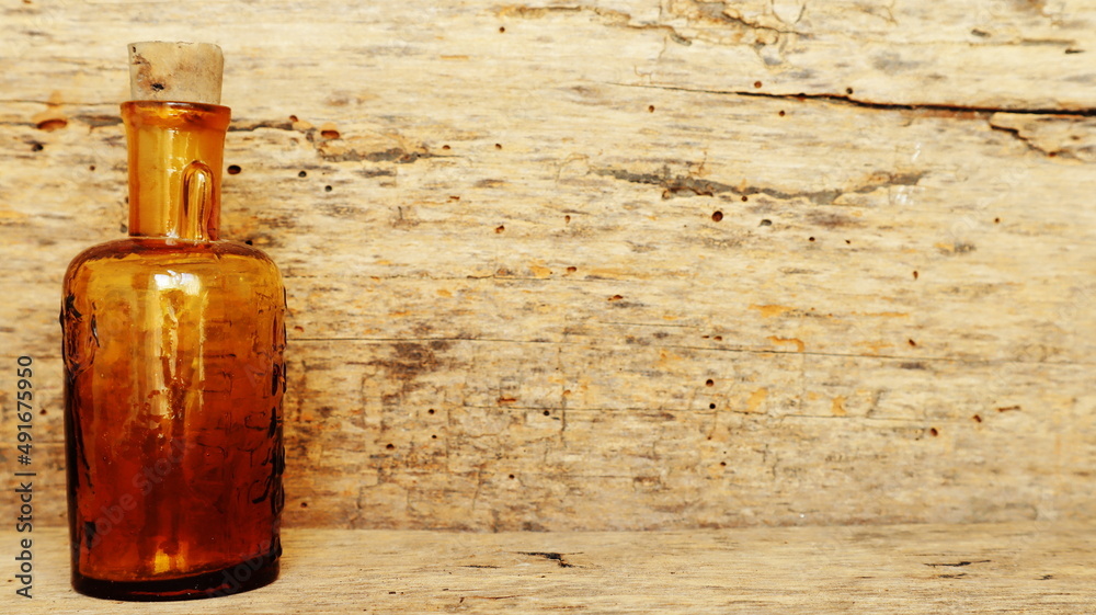 Antique Medicine Bottle, Victorian Era, on a original 1800s wooden background with space for your text or design