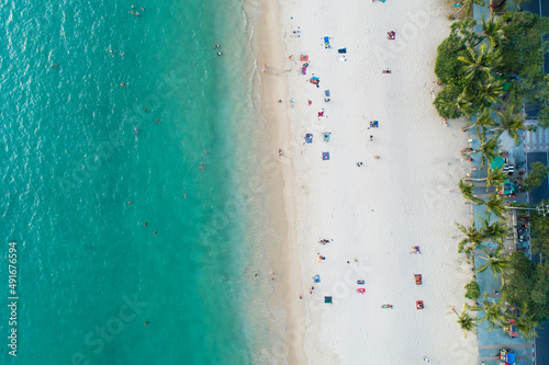 Aerial view top down of Coconut palm trees on the beautiful patong beach Phuket Thailand Amazing sea beach sand tourist travel destination in the andaman sea Beautiful island