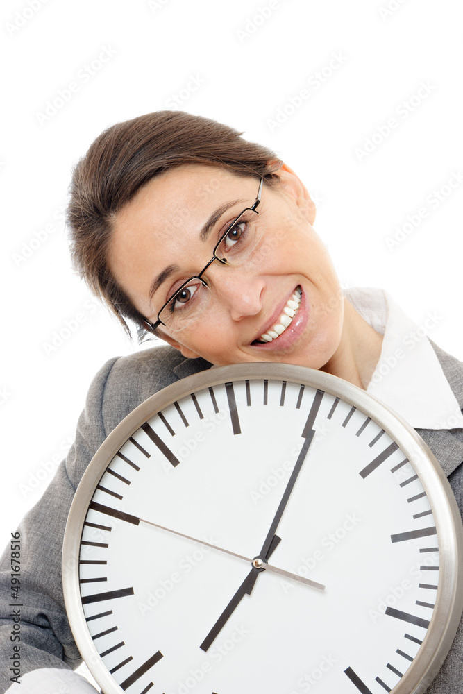Young business woman smiling holding a clock on white background. Young business woman smiling holding a clock on white background.