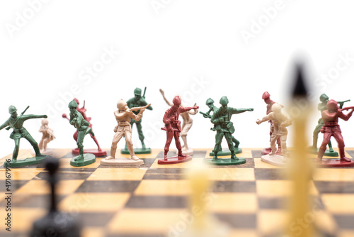 Valokuvatapetti Photo plastic toy soldiers on a chessboard