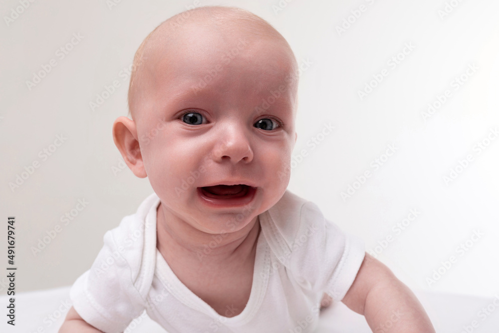 baby close-up on a white background crying