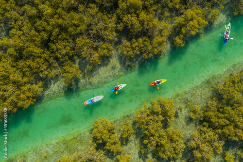 Aerial view of people doing kayak in a small river off Abu Dhabi, United Arab Emirates. photo