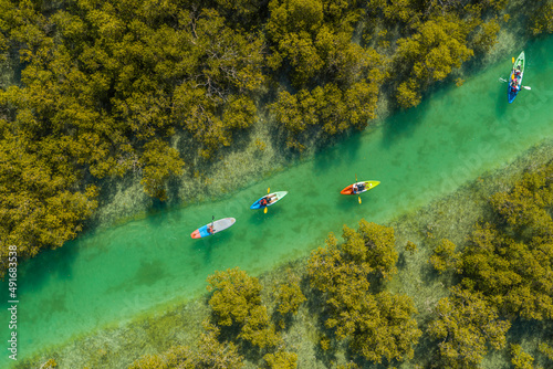 Aerial view of people doing kayak in a small river off Abu Dhabi, United Arab Emirates.