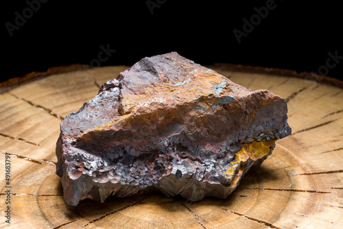 A piece of solid hematite with its rough texture. The natural raw stone of great healing power photo