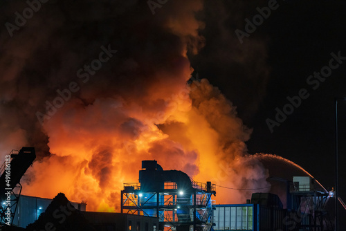 Fireman tackle Industrial Fire at large recycling centre photo