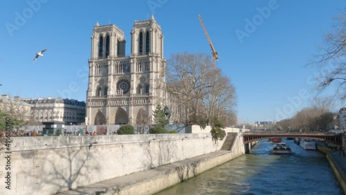 Notre Dame de Paris. Cathedral of notre dame de paris over the Seine. Bateau mouche. Blue sky, beautiful day photo