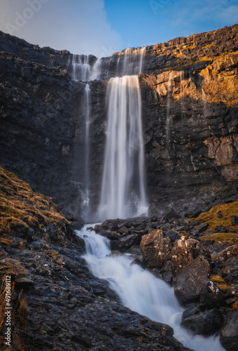 Long shot of whole Fossa waterfall in Faroe Islands. November 2021.