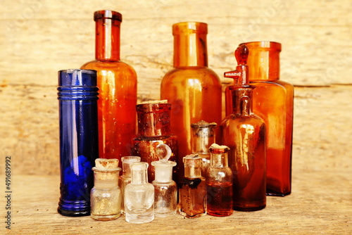 Antique Medicine Bottles  Victorian Era  on a original 1800s wooden background