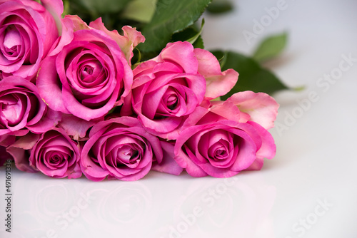Bouquet of pink roses on white background. Flower background. Mothers Day, Wedding and Birthday concept.