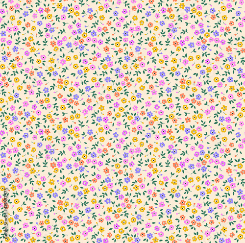 Seamless floral pattern. Ditsy background of small colorful flowers and green leaves. Small-scale flowers scattered over a beige background. Stock vector for printing on surfaces and web design.