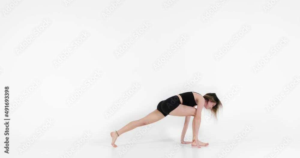 Blonde woman doing yoga in studio closeup Blonde woman doing yoga in studio closeup