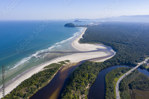 linda paisagem aerea da praia de Itaguaré com a praia de Guaratuba incluindo a junção do rio com o Mar photo