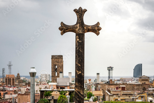 a cross on the terrace of the cathedral of barcelona has a spectacular view over the city