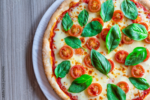 A traditional rustic Italian margarita pizza shot from above