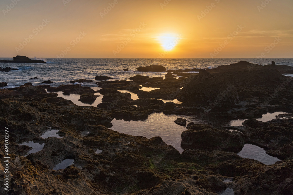 Picturesque sunset on the Atlantic Ocean in the area of Essaouira in Morocco on a summer evening.